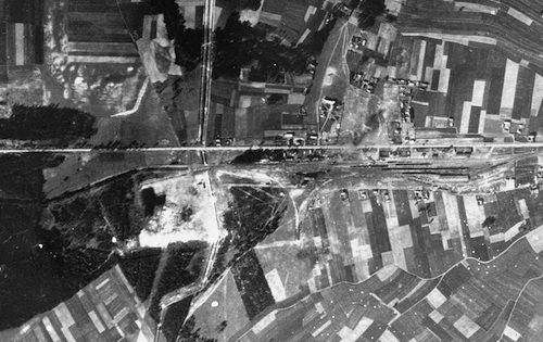 An aerial view of the Belzec area taken by the Luftwaffe during the war, which shows the camp and the rail lines leading to it. Circa 1944. Photo Credit: United States Holocaust Memorial Museum, courtesy of National Archives and Records Administration, College Park