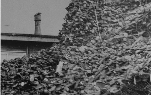 Piles of shoes stored in awarehouse in Auschwitz