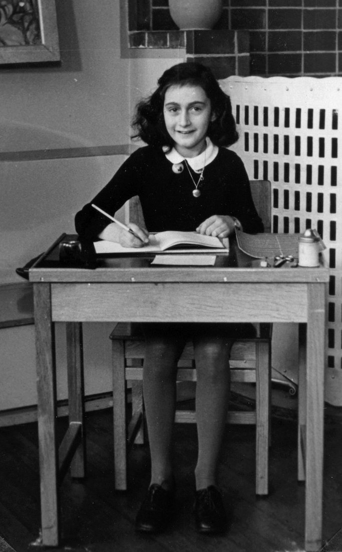 Anne Frank in 1940, while at 6. Montessorischool, Niersstrraat 41-43, Amsterdam (the Netherlands). Photograph by unknown photographer, via Wikimedia Commons.