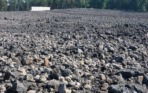 Field of stones covering mass graves in Belzec. By Lysy (Own work) [CC BY-SA 3.0 (http://creativecommons.org/licenses/by-sa/3.0)], via Wikimedia Commons.